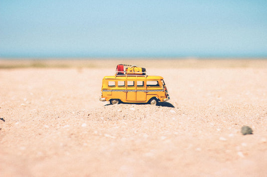 Travel bus in sand for a holiday